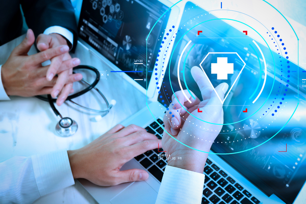 The image shows two data scientists working on a laboratory computer. Data science is displayed on the screen.